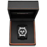 A Cornavin chronograph watch with a black dial and black strap, presented inside an open black textured gift box with orange stitching.