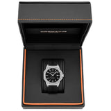 A Cornavin AT.03.R watch with a black lacquered dial, stainless steel case, and a black silicone strap.