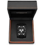 A black and silver Cornavin watch with a black strap and silver-toned case details, presented inside an open black textured gift box with orange stitching.