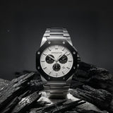 Cornavin watch on black background standing on lack stones and white sand