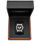 A Cornavin chronograph watch with a black dial and black strap, presented inside an open black textured gift box with orange stitching.