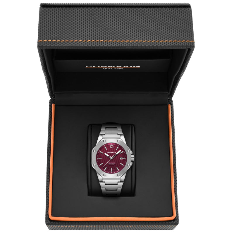 CORNAVIN CO 2021-2036 - Swiss Made Watch with a ruby red dial and stainless steel bracelet.