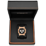 A Cornavin men's watch with a rose gold case, black dial, and black strap, presented inside its open textured black gift box with orange stitching.