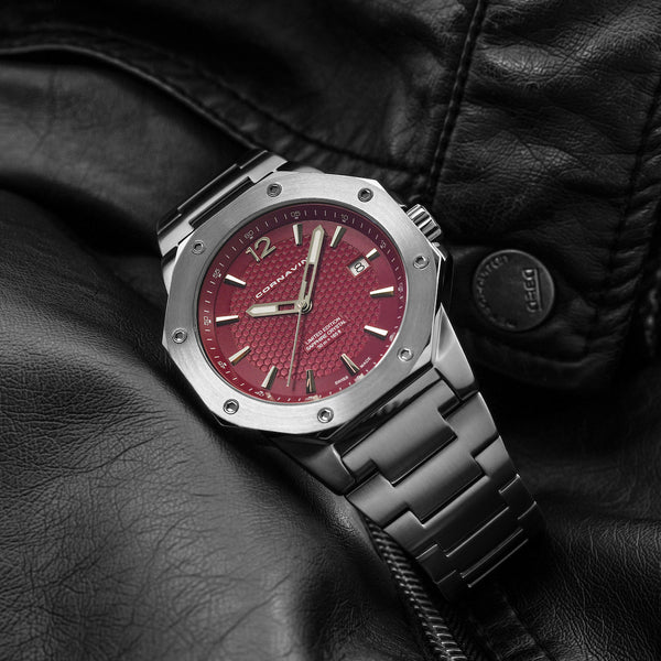 CORNAVIN CO 2021-2036 - Swiss Made Watch with a ruby red dial and stainless steel bracelet.